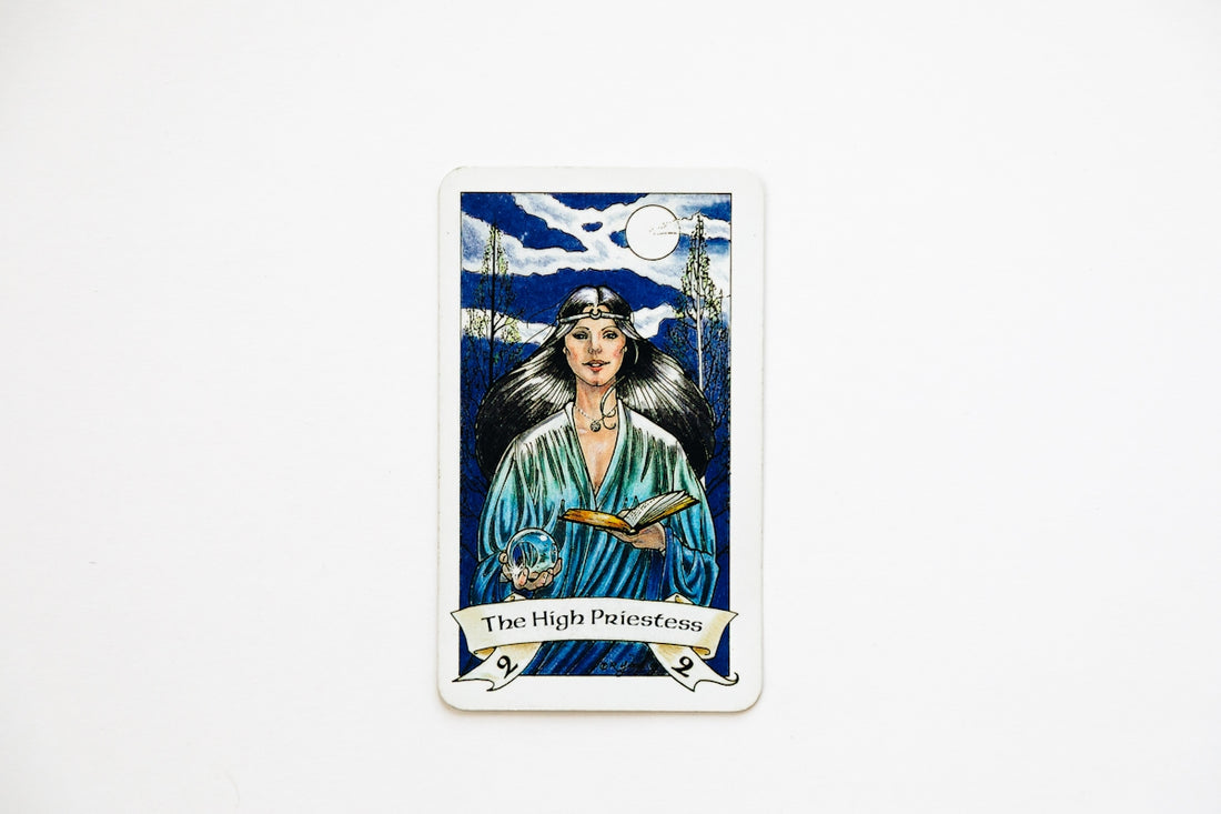 The high priestess tarot card on a white background