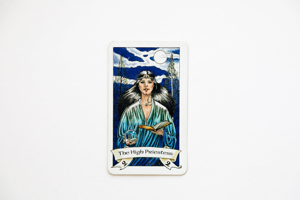 The high priestess tarot card on a white background